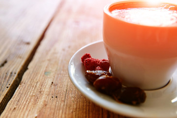 Cup of coffee on a wooden background