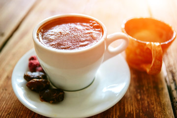 Cup of coffee on a wooden background