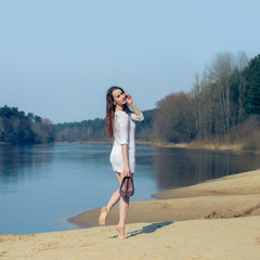 beautiful girl on the beach alone. Girl on the beach happy heat