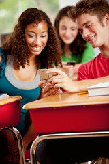 Students: Girl Looks At Text Message On Friend's Phone