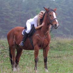 Fototapeta premium Romantic girl in a white horse. beautiful girl and a horse