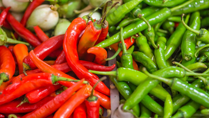 Heap of red and green Cayenne pepper (Capsicum annuum) for sale