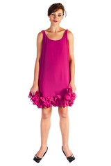 Young and sexy woman model in pink dress posing