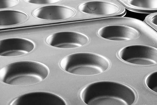 Cake tins.
Stainless steel cake tins isolated.