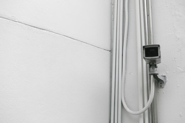 security camera on the white wall