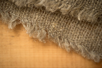 Gunny sack texture and wood plank table background