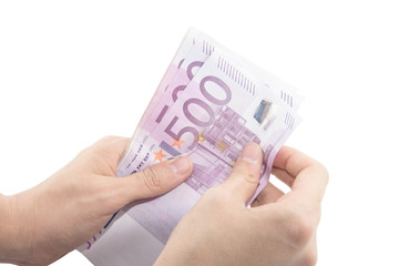 Isolated hands counting five hundred Euro banknotes