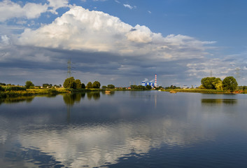 Fototapeta na wymiar Power plant in the evening on the Odra river near Opole