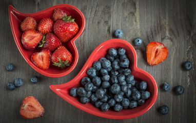 Blueberries and strawberry in heart plate
