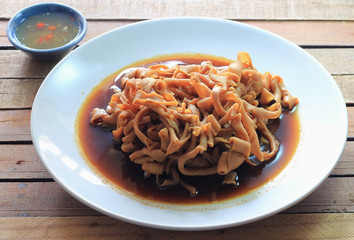 Steamed duck,Duck filling, spices and sauces on the plate on  wooden background