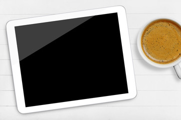 Tablet and coffee cup