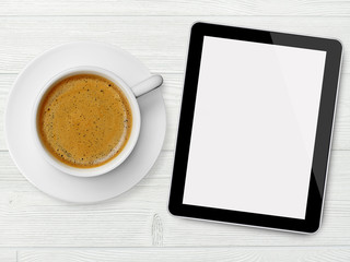 Tablet and coffee cup