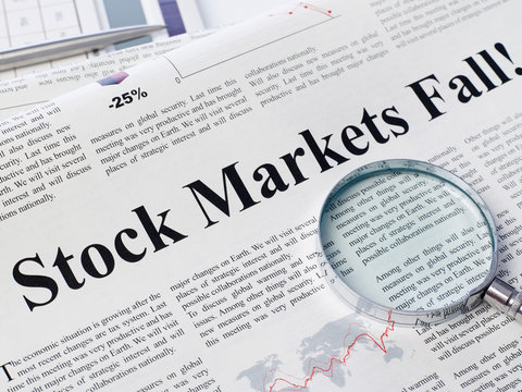 Stock market fall headline on newspaper