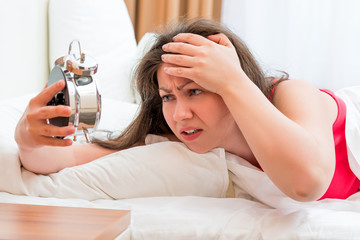 Fototapeta premium frustrated woman trying to sleep with insomnia