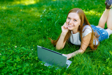 Beautiful smiling red-haired young woman