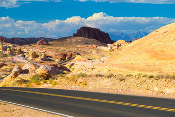 Fototapeta na wymiar Winding road amid White Domes in Valley of Fire State Park, Nevada
