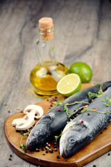 Raw seabass fish on the wooden board