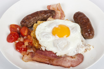 Traditional Breakfast of Egg, Bacon, Sausages, Tomato and Toast