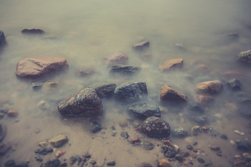 Sunrise over the sea. Beautiful long exposure landscape of rocky