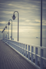 Gdynia Orlowo pier. Vintage photo of Baltic sea shore seascape.