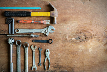 Set of work tools on old grunge wood background with copy space - obrazy, fototapety, plakaty