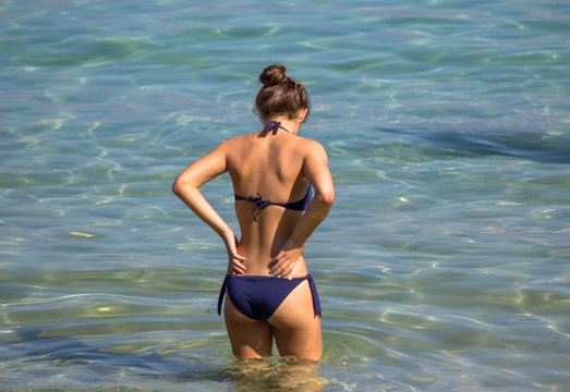 Attractive young woman in bikini on the beach