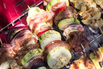 BBQ with fiery sausages on the grill