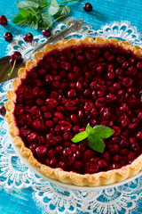Homemade cherry pie, shortbread dough and cherry jelly on top
