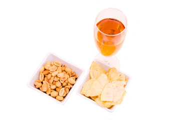 Aperitif and pretzels on a white background seen from above