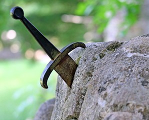excalibur the famous sword in the stone of king Arthur in the fo