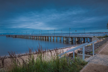 Fototapeta na wymiar Gdynia Orlowo pier. Vintage photo of Baltic sea shore seascape.