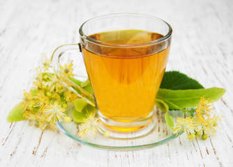 Cup of herbal tea with linden flowers
