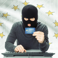 Hacker holding credit card and USA state flag - Rhode Island