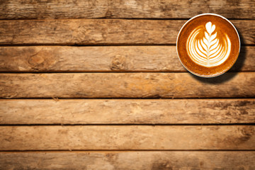 Coffee cup top view on wooden table background with copy space