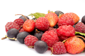 healthy eating concept: different fresh berries, strawberries, raspberries, black currants and grossberies macro shot