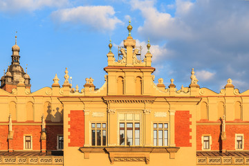 Facade of Cloth Hall building Sukiennice in sunset light on main market square of Krakow city, Poland