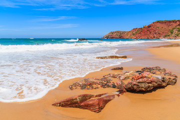 Stone on Praia do Amado beach, famous place for surfing, Algarve region, Port