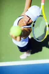 Foto auf Leinwand Beautiful female tennis player serving © NDABCREATIVITY