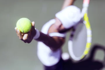 Badkamer foto achterwand Beautiful female tennis player serving © NDABCREATIVITY