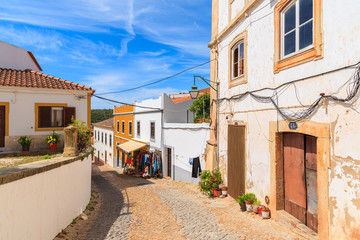 Fototapeta na wymiar Narrow street in old town of Silves with colorful houses, Portugal