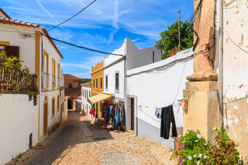 Narrow street in old town of Silves with colorful houses, Portugal