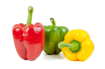 Three colored peppers on white background