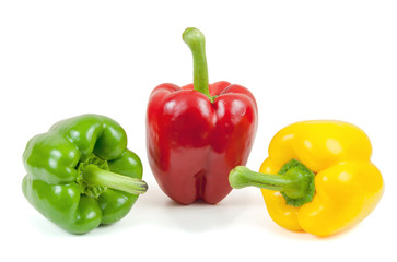 Three colored peppers on white background