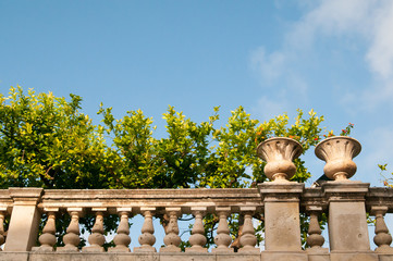 Partial view of the balustrade and of the garden laying by the episcopal palace in Syracuse