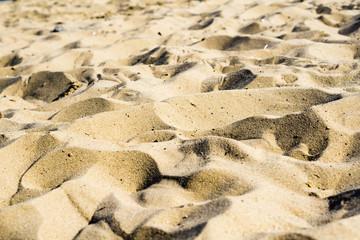Hills of sand on beach as desert