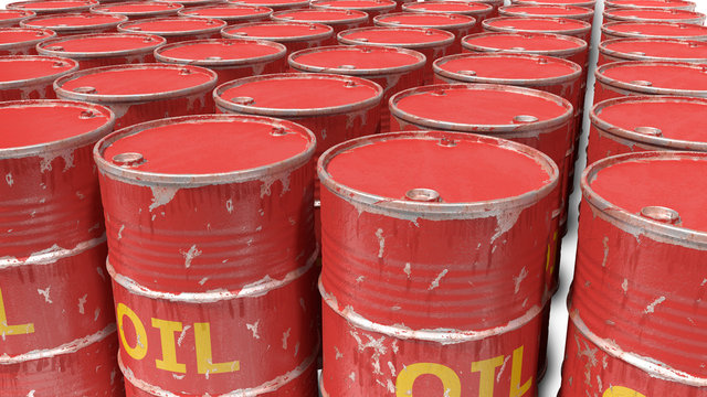 large number of dirty worn scratched oil barrels