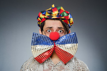 Funny clown against dark background