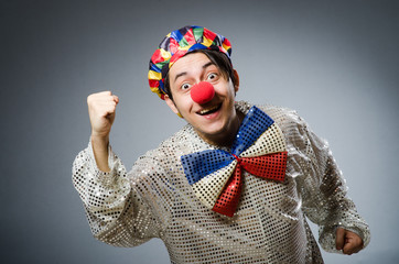 Funny clown against dark background