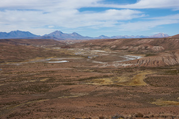 Large open plain created by the River Lauca in Lauca National Park, high up in the Altiplano of northern Chile. The area is used by local people for grazing Alpaca and Llama.