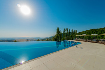 Infinity pool on the bright summer day